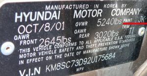 Hyundai factory paint code label in the driver-side door jamb